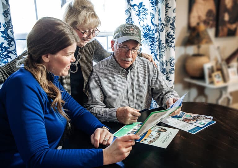 Caretech Care Coordinator assisting an elderly client at home, representing compassionate in-home support provided through the Medicaid waiver program.